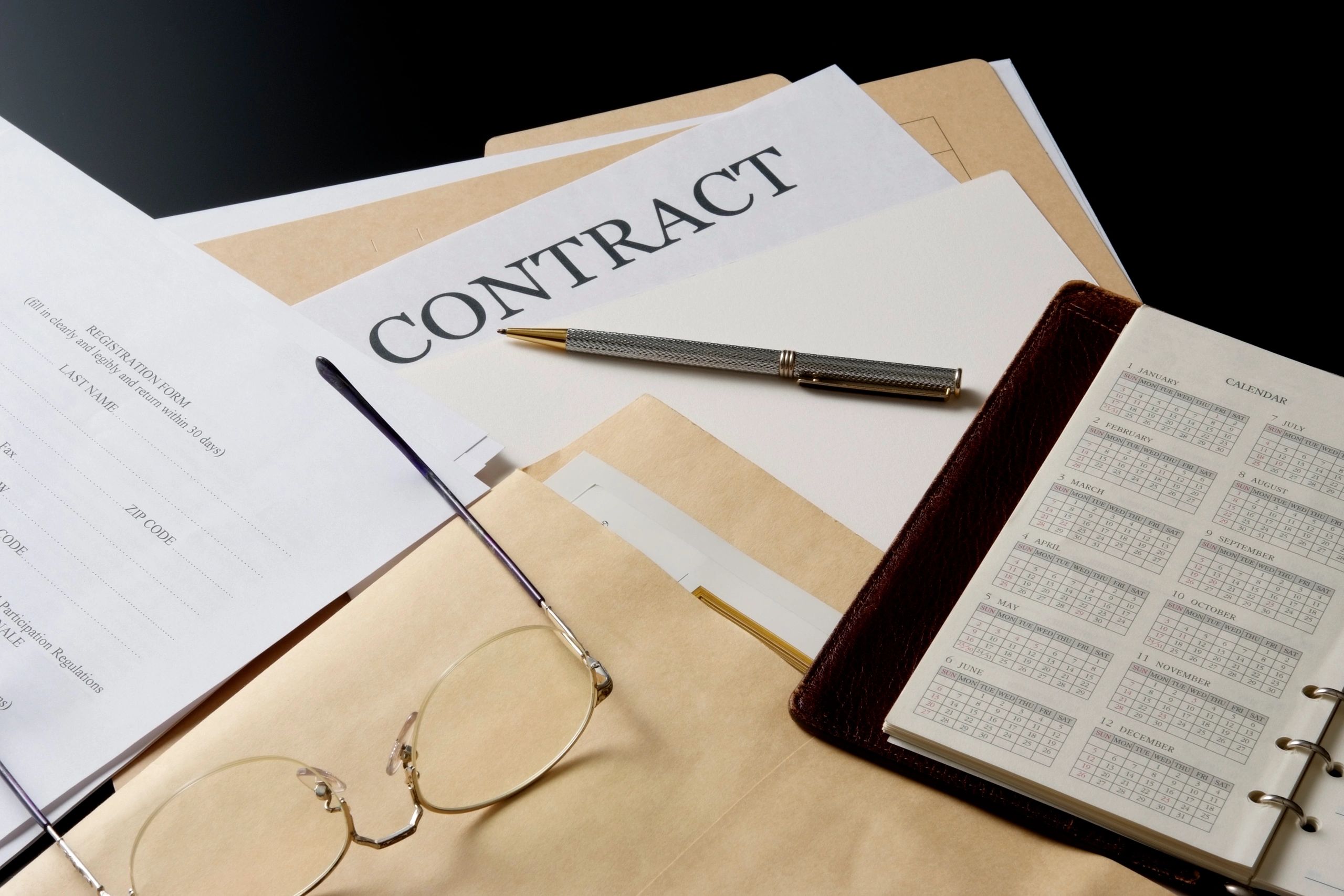 Contract documents on an office desk
