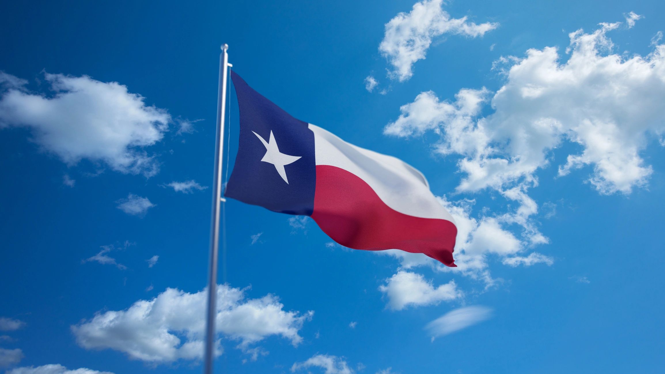 Texas flag against a clear sky