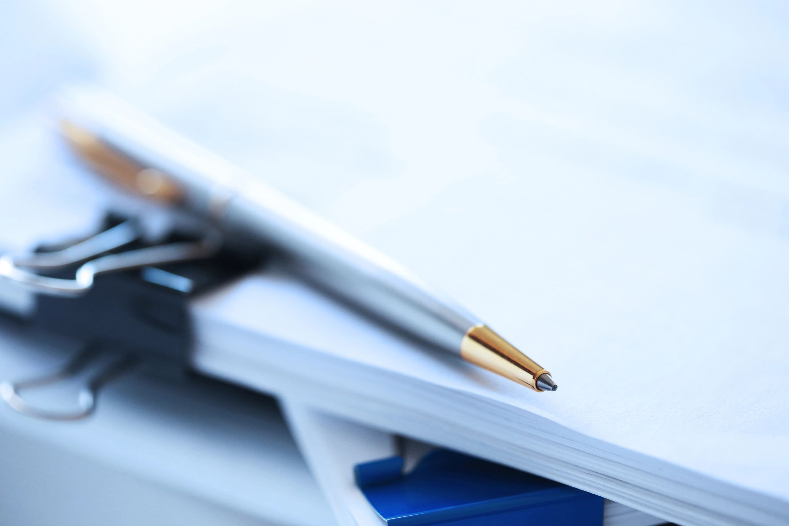Pen resting on legal documents representing careful estate planning